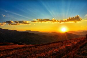 Sunset over countryside and mountains